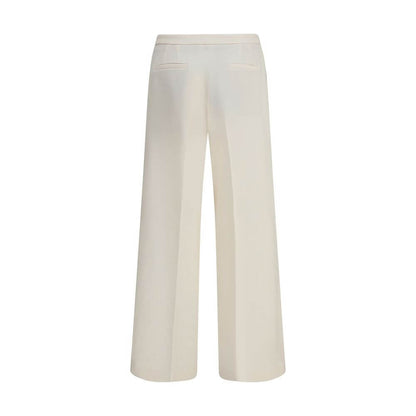 Back view of Cruna Cream Polyester Casual Pants with wide legs, featuring back welt pockets, ideal for versatile casual and refined looks.