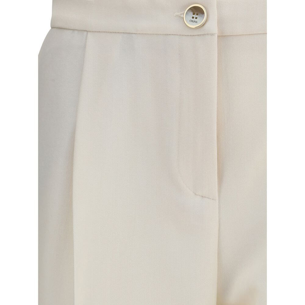 Close-up of Cruna Cream Polyester Casual Pants showing front zip and button details.