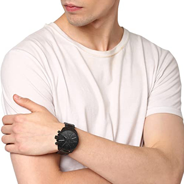 Man wearing DIESEL Mod. DZ4537 wristwatch 48mm SS IP black case, quartz movement, chronograph date function, water resistant 5 ATM.