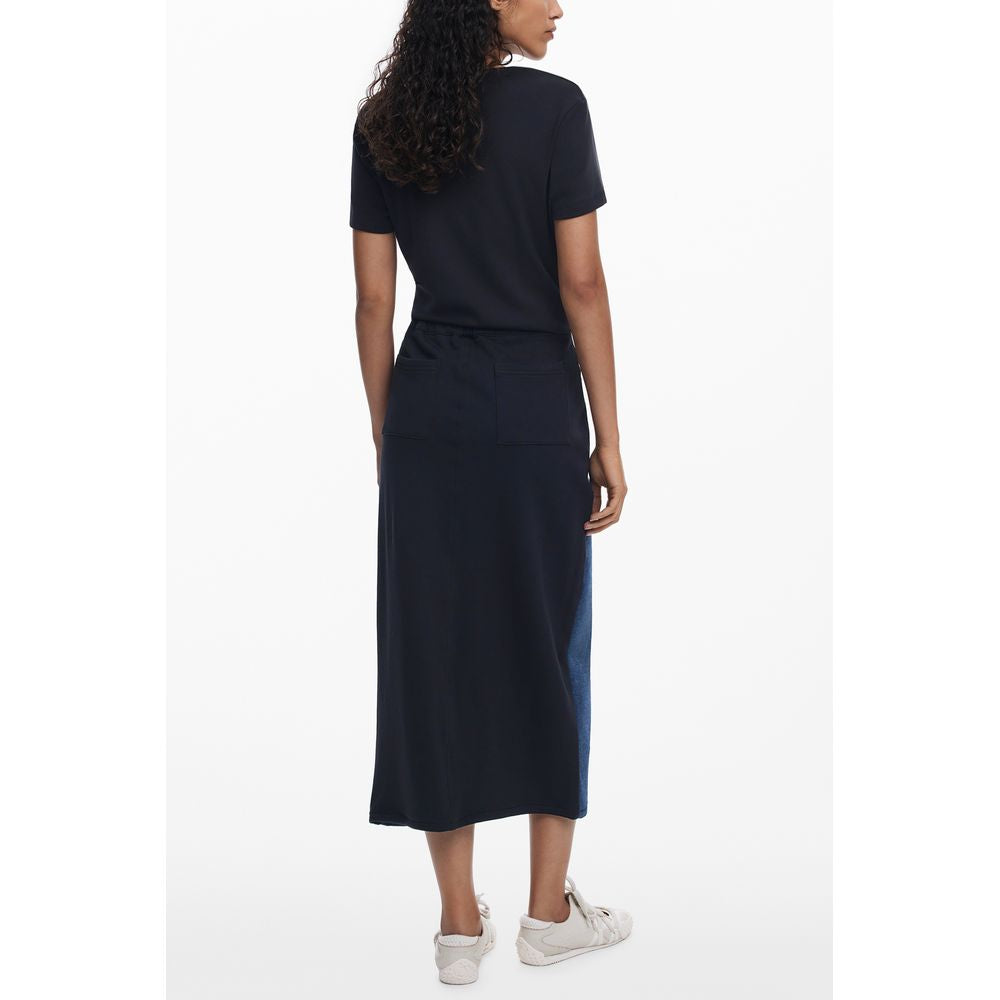 Woman wearing Desigual Blue Cotton Women Skirt with twisted silhouette and contrasting details, side view showcasing the elegant design.