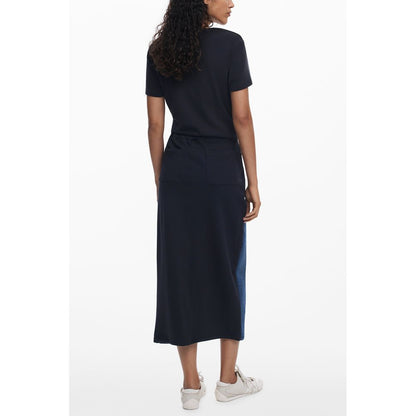 Woman wearing Desigual Blue Cotton Women Skirt with twisted silhouette and contrasting details, side view showcasing the elegant design.