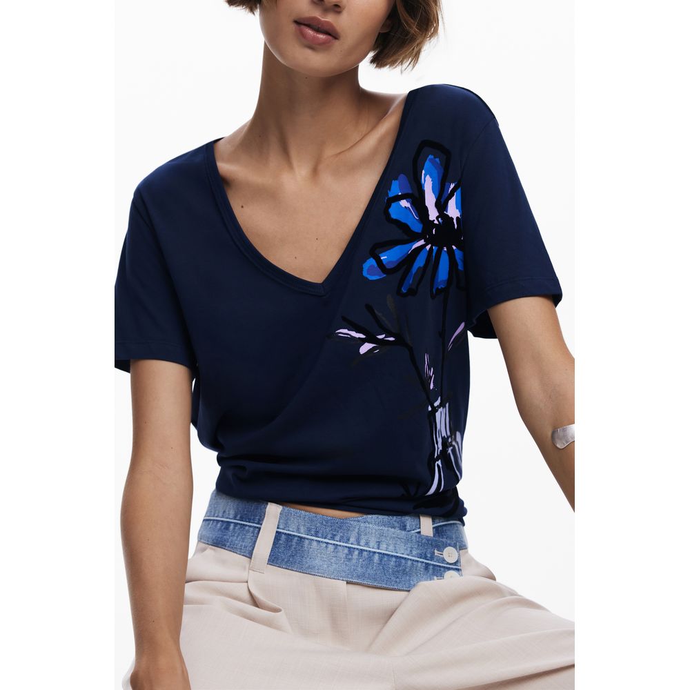 Alt Tag: Woman wearing Desigual Blue Cotton Women T-Shirt with chic V-neck and bold floral print design.