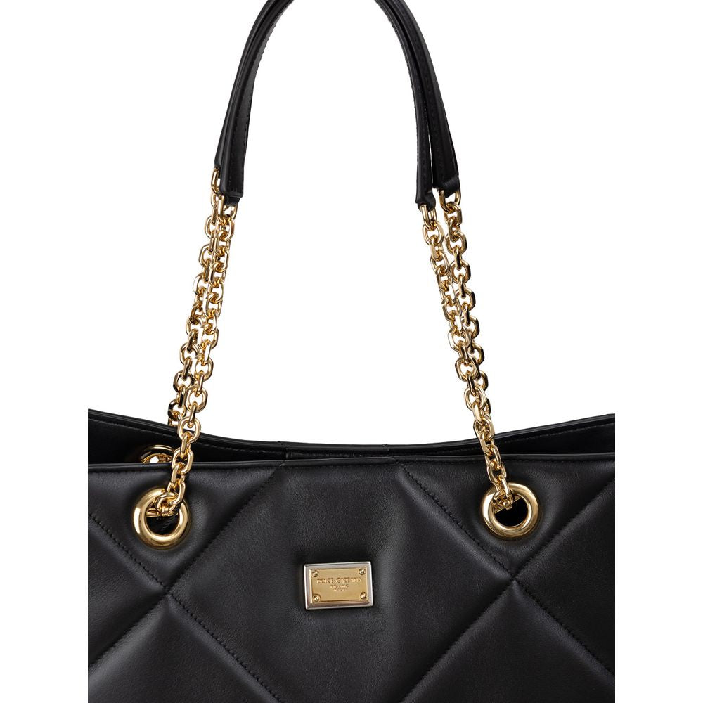 Dolce & Gabbana Black Leather Matelassé Tote Bag with gold chain handles and logo tag, featuring elegant quilted design.