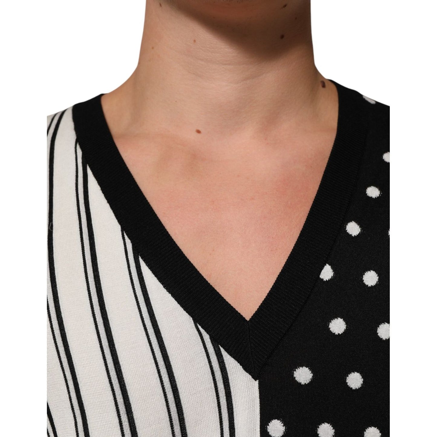 Close-up of Dolce & Gabbana Black White Stripe Polka V-Neck Pullover Sweater showcasing striped and polka dot design.