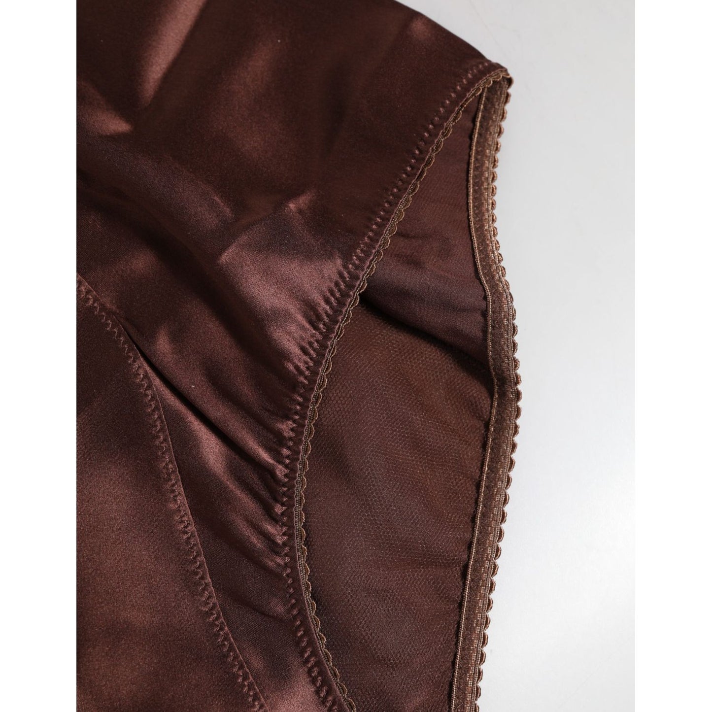 Close-up of Dolce & Gabbana brown silk high-waist girdle, showcasing luxurious stretch material and expert craftsmanship.