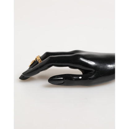 Dolce & Gabbana Gold Tone Brass Oval DG Logo Chain Adjustable Ring displayed on black mannequin hand
