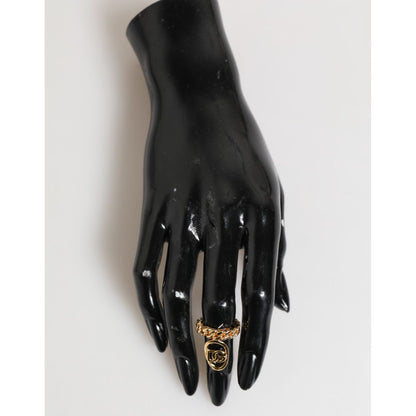 Dolce & Gabbana Gold Tone Brass Oval DG Logo Chain Adjustable Ring on black mannequin hand display