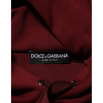 Dolce & Gabbana Maroon Embossed Logo Hooded Sweatshirt Sweater close-up view of label and fabric texture