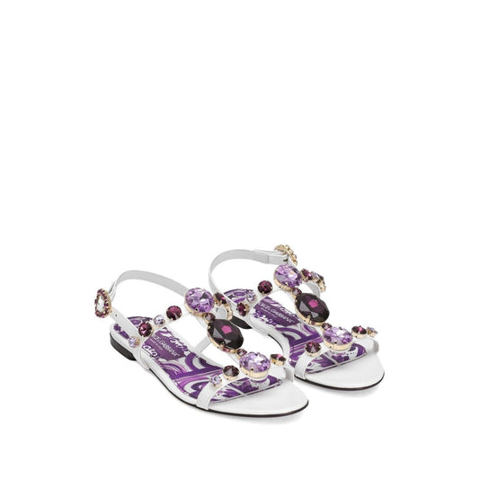 Dolce & Gabbana Sandals Purple with white rhinestone embellishments, side buckle fastening, and flat Maiolica leather sole.