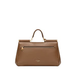 Dolce & Gabbana Sicily soft leather handbag in caramel brown with foldover top, single handle, and detachable shoulder strap.