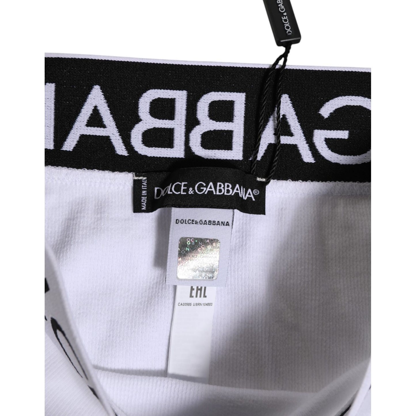 Close-up of Dolce & Gabbana high waist white panty showing label and logo waistband, made in Italy.