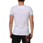 Back view of model wearing Dolce & Gabbana White Short Sleeves Deep V-Neck Men T-shirt, featuring logo details and comfortable fit.