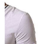Close-up of Dolce & Gabbana White Short Sleeves Deep V-Neck Men T-shirt with logo details, highlighting soft cotton material.