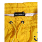 Dolce & Gabbana Yellow Nylon Logo Print Men Boxer Short Swimwear with elastic waistband and drawstring