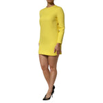 Dolce & Gabbana Yellow Viscose Acetate Mini Long Sleeve Dress with crew neckline in elegant style, featuring a woman wearing heels.