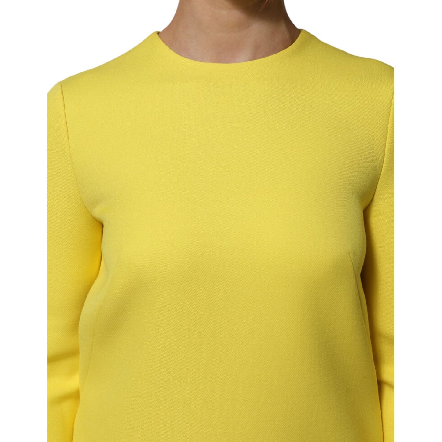 Dolce & Gabbana Yellow Viscose Acetate Mini Long Sleeve Dress with clean crew neckline, close-up view of front.