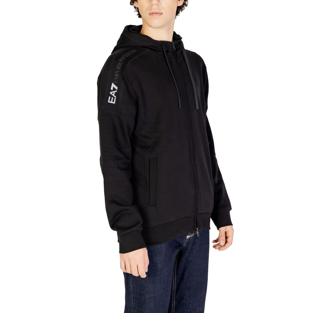 EA7 Emporio Armani Black Cotton Hoodie for men, featuring zip closure and adjustable hood. Model wearing hoodie showcasing versatility and style.