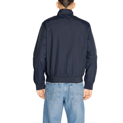 Back view of EA7 Emporio Armani Blue Polyamide Jackets And Coat, showcasing its design and fit. Perfect for sporty, modern style.