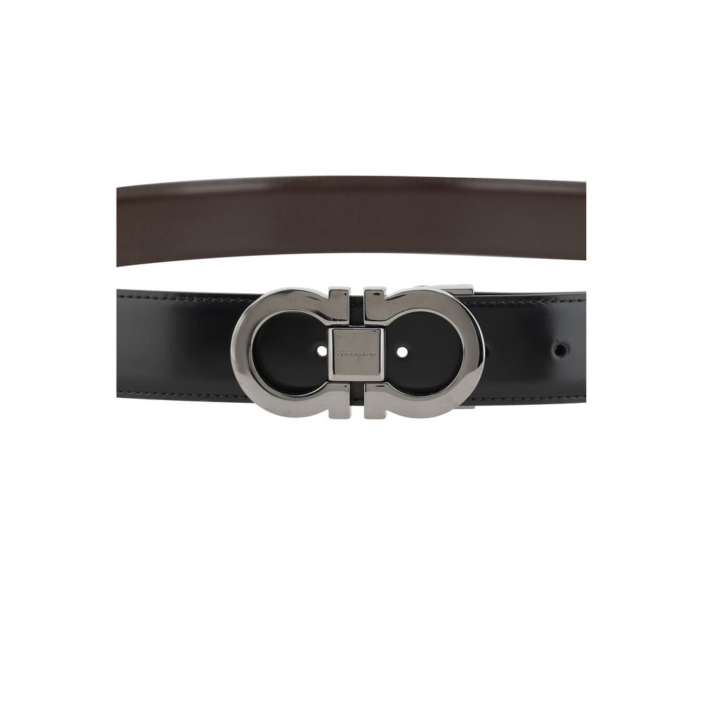 Ferragamo Black Calf Leather Bos Taurus Regular Belt with Gancini buckle, reversible design in black and brown leather, 3 cm thickness.