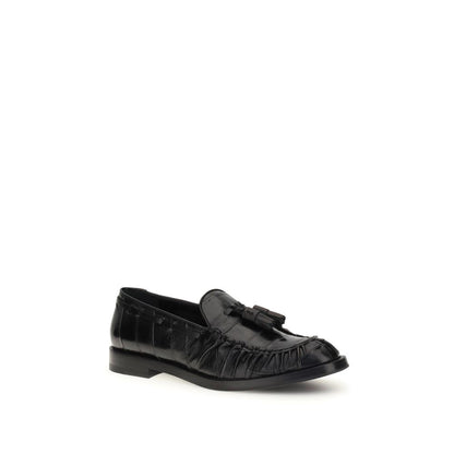 Fratelli Rossetti Black Rubber Slip-On Loafers with tassels and round toe, offering a versatile fit for smart or casual looks. AW25 collection.