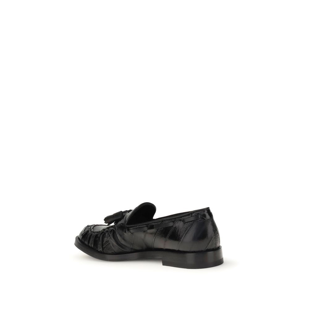 Fratelli Rossetti Black Rubber Slip-On Loafers with tassels, side view showcasing leather upper and flat sole, ideal for smart or casual looks.