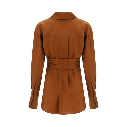 Back view of GAUGE81 Sabinas Shirt in brown silk, featuring a low collar and adjustable cuffs with engraved buttons, AW22 collection.