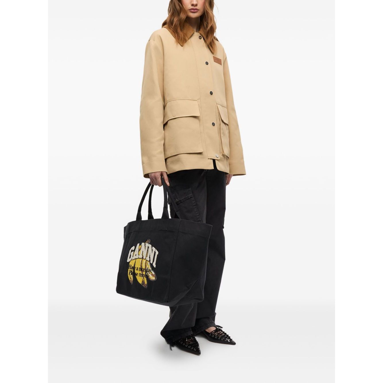 Front view with bag zipped and handles upright.