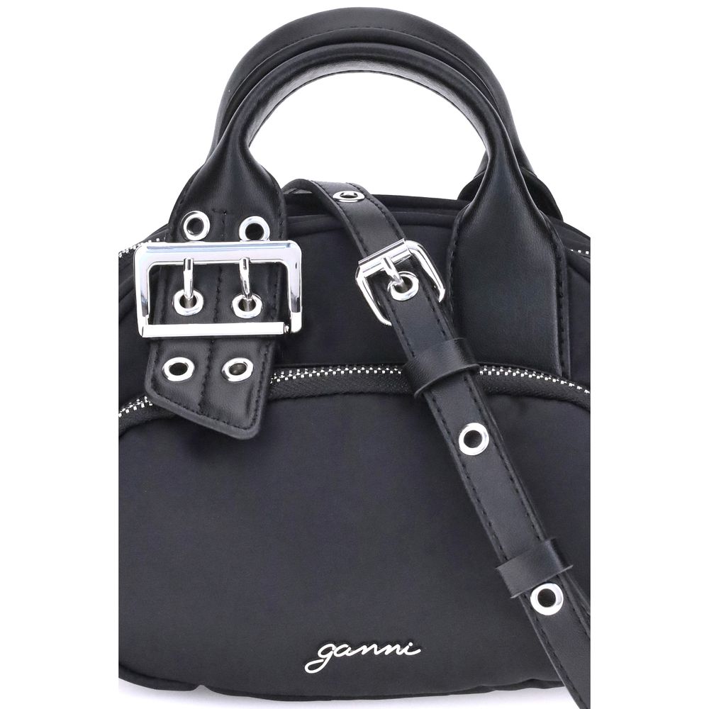Ganni Polochon mini Handbag in black with top handle, adjustable shoulder strap, metallic trim, and GANNI logo. Functional and stylish accessory.