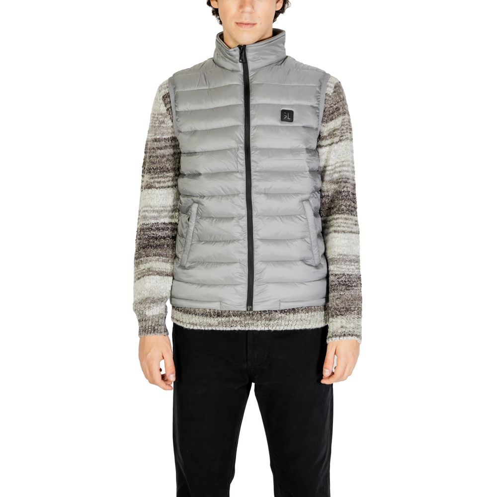 Gianni Lupo Gray Polyamide Sleveless Jacket with quilted design and front zip, worn by model for stylish winter look.
