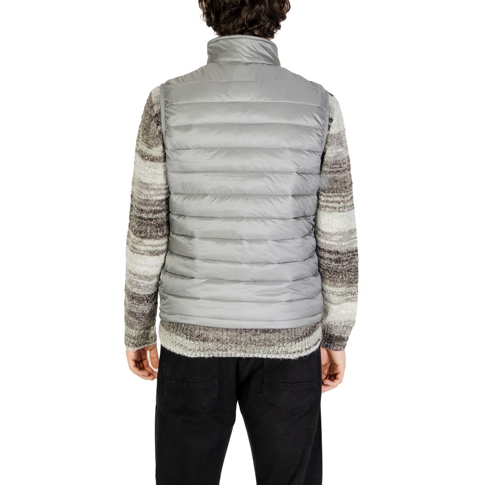 Back view of a model wearing the Gianni Lupo Gray Polyamide Sleveless Jacket showcasing its quilted design and fit.
