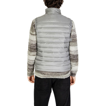 Back view of a model wearing the Gianni Lupo Gray Polyamide Sleveless Jacket showcasing its quilted design and fit.