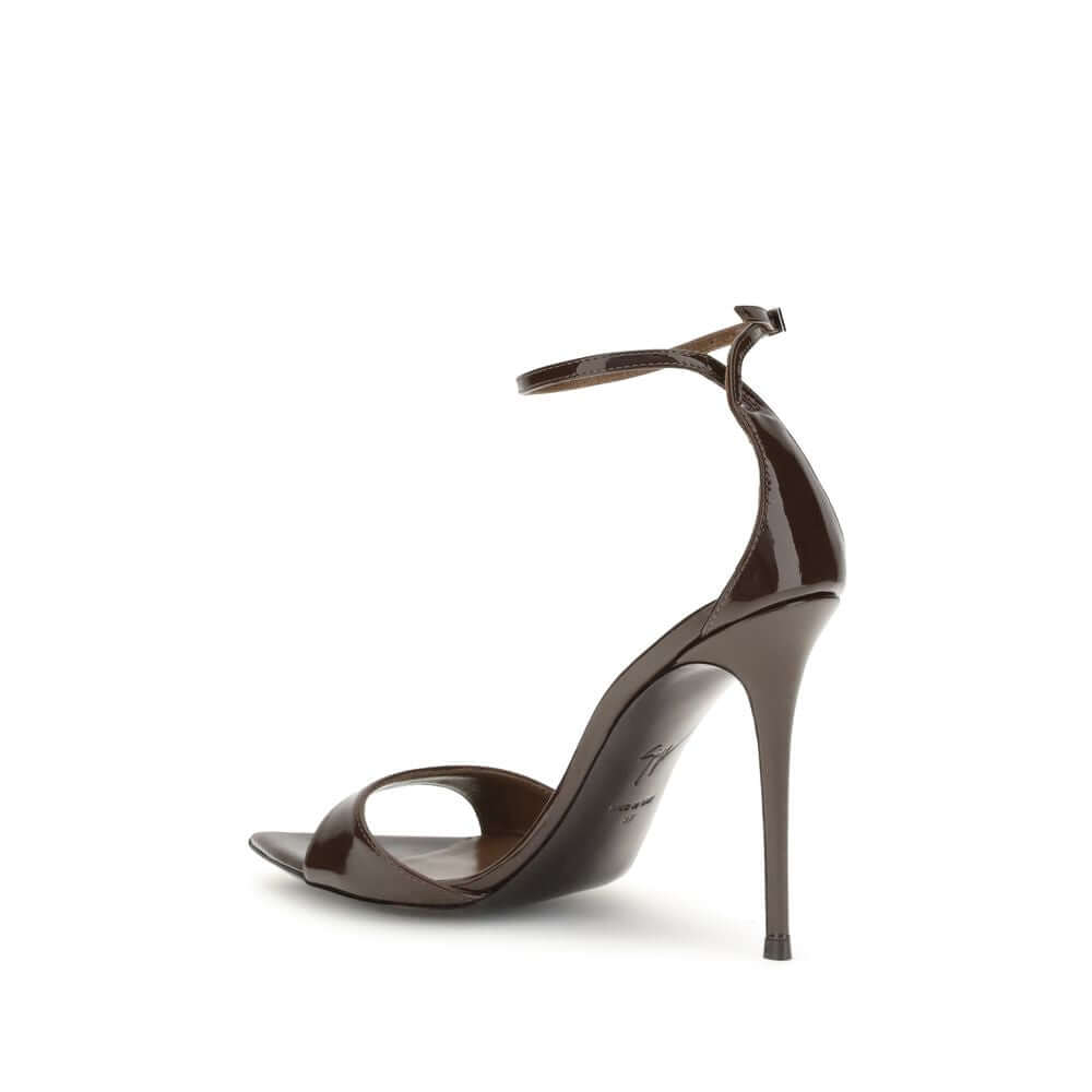 Giuseppe Zanotti Black Leather Stiletto Heel Sandals with pointed open-toe, silver metal strap, side view.