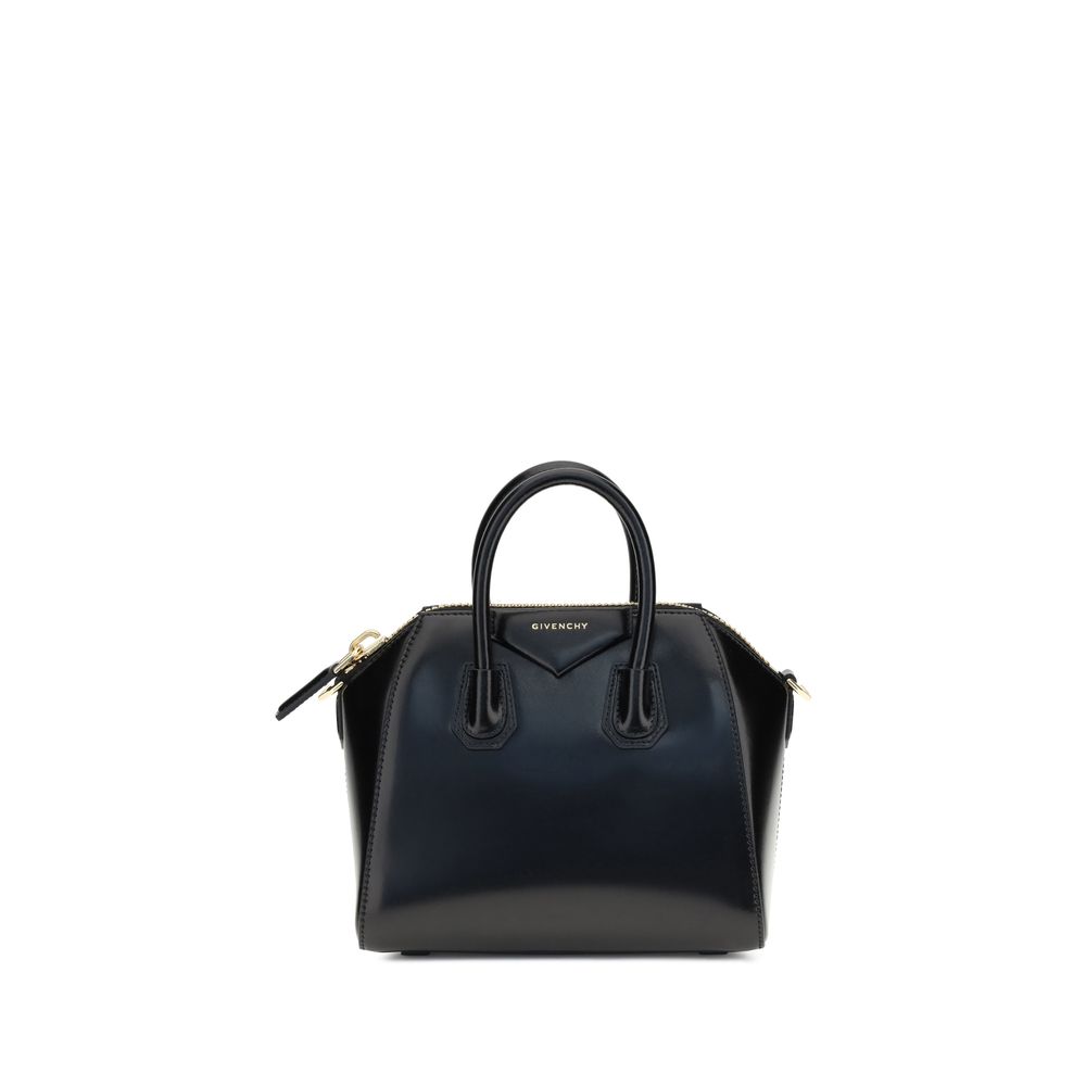 Alt Tag: Givenchy Black Calf Leather Bos Taurus Handbag with geometric pattern and iconic monogram, featuring a glossy finish and dual handles.