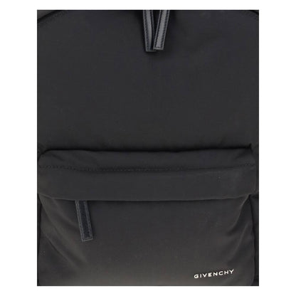 Close-up of Givenchy Black Polyamide Backpack with front metal signature and zippered pockets.