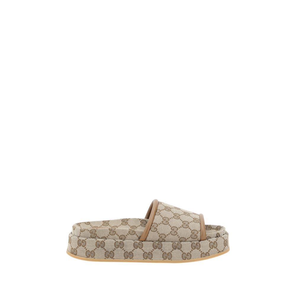 Gucci Beige Polyamide Flat Sandals with GG Supreme pattern, featuring leather trim and platform style for modern elegance and comfort.