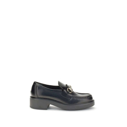 Gucci Black Calf Leather Bos Taurus Slip-On Loafers with iconic horsebit detail, perfect for elegant formal and everyday looks.