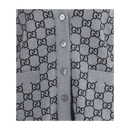 Gucci Black Wool Cardigan with GG Supreme pattern, reversible design, V-neckline, ribbed trim, and two front pockets in black and white.