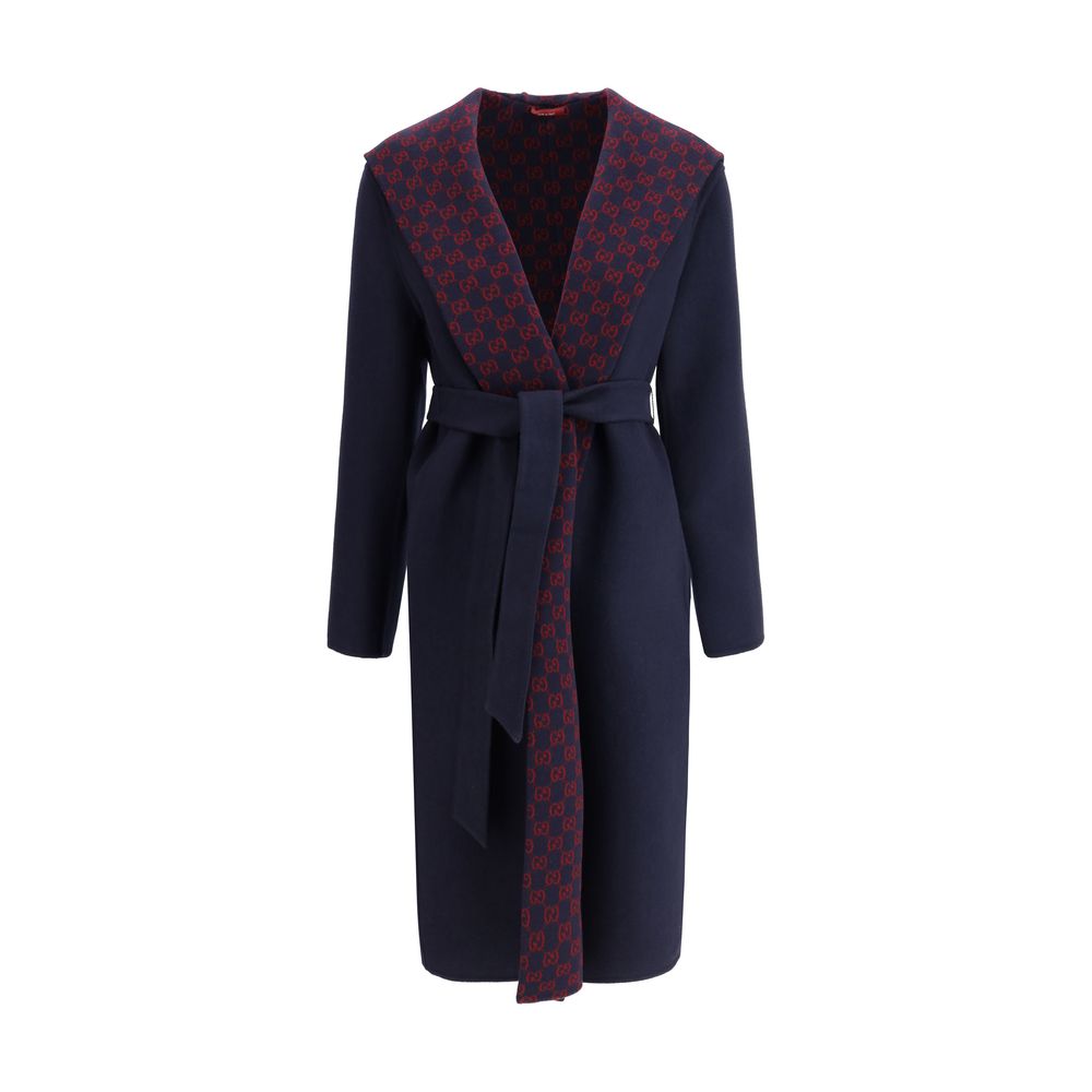 Gucci Blue Wool Coat with monogram hood and sash, elegant design, side welt pockets, and contrasting interior.