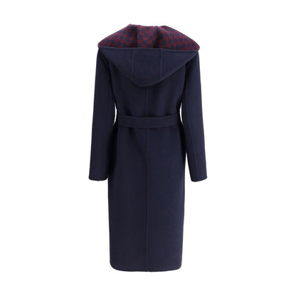 Gucci Blue Wool Coat with hood, removable sash, and Gucci monogram on inner panel, showcasing elegant and functional design.
