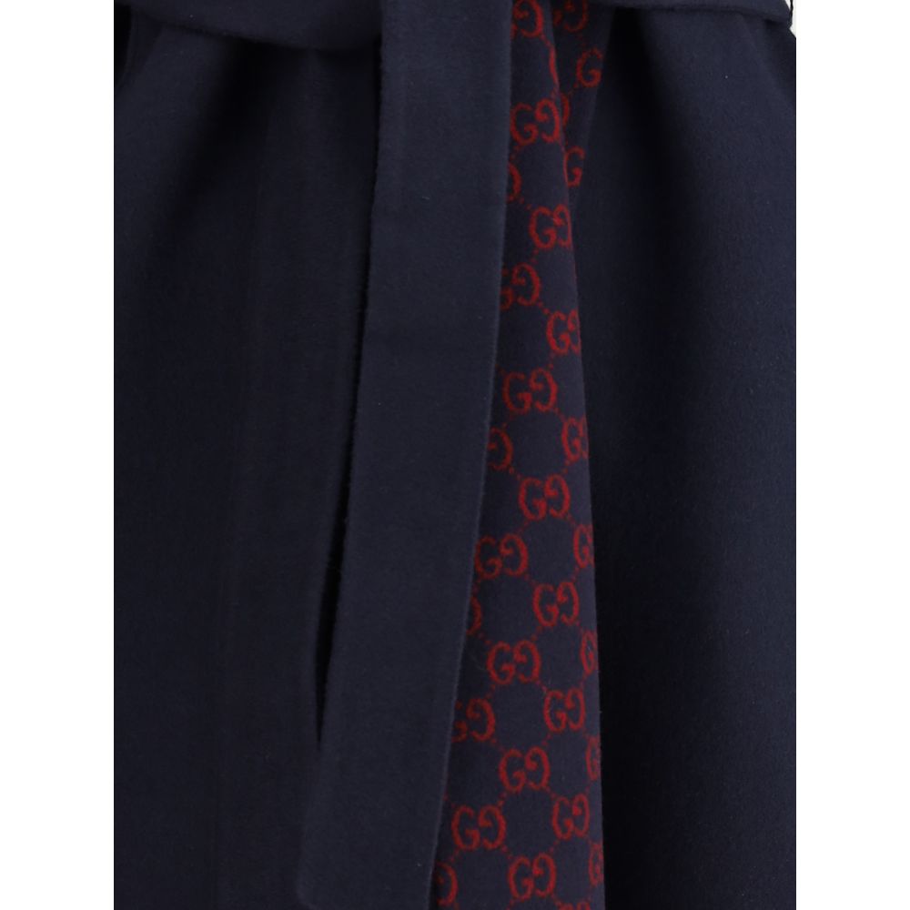 Gucci Blue Wool Coat with monogram inner panel and removable sash, showcasing luxury fashion details.