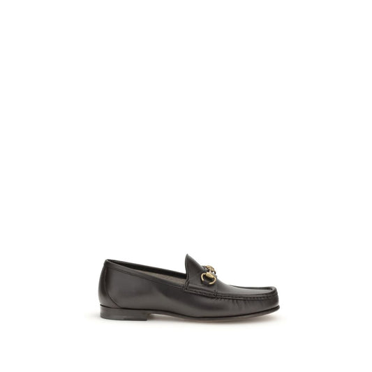 Gucci Brown Calf Leather Bos Taurus Slip-On Loafers with Horsebit detail and gold-tone hardware, part of 1953 Collection.