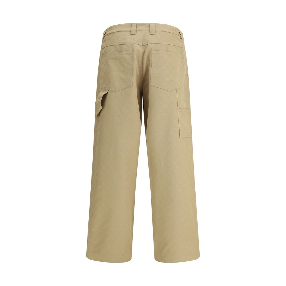 Gucci Cotton Pants with all-over GG pattern, featuring belt loops and a carpenter-style pocket. Made in Italy, regular fit.