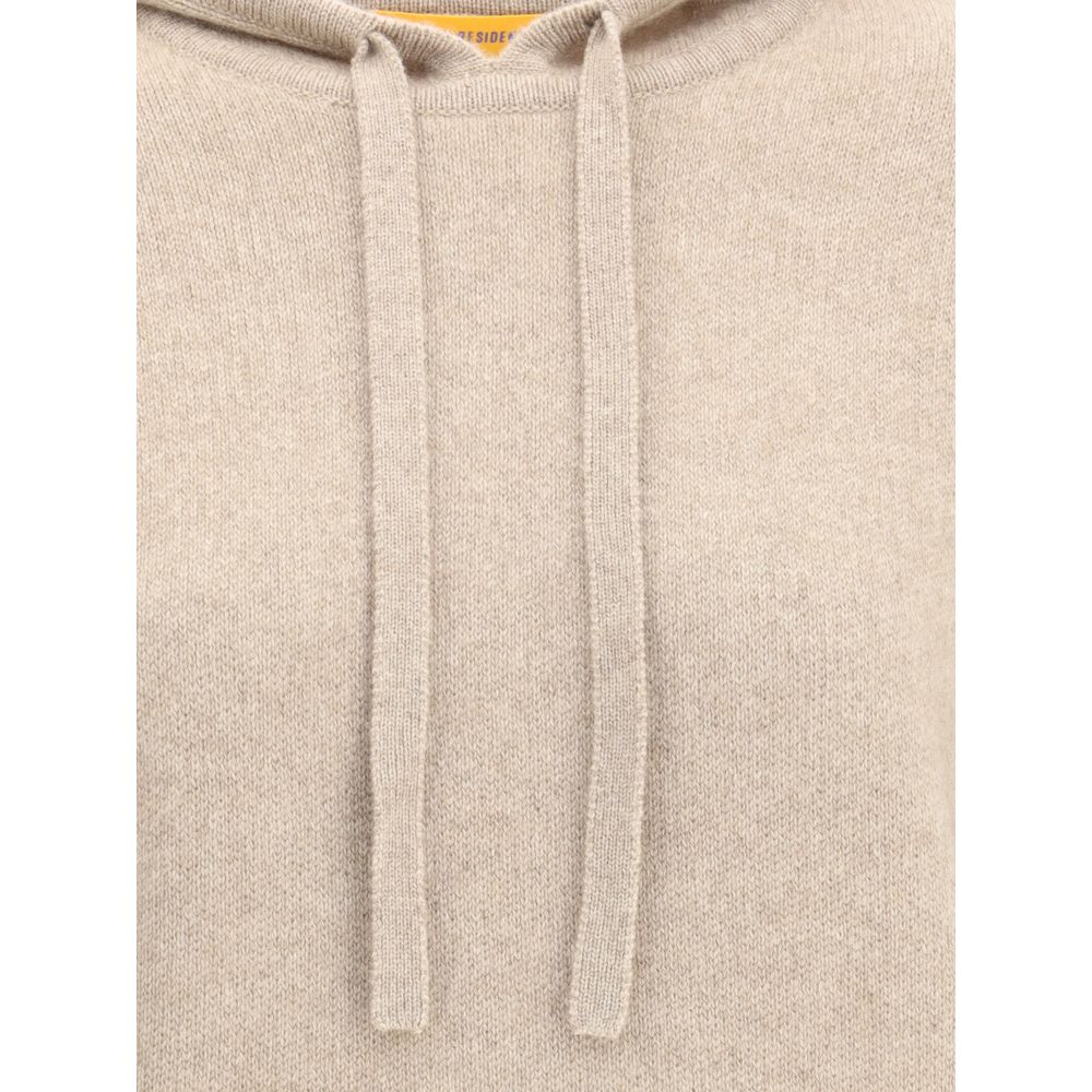 Guest in Residence Beige Cashmere Hoodie with adjustable drawstring, showcasing ribbed hem and cuffs for a refined, comfortable fit.