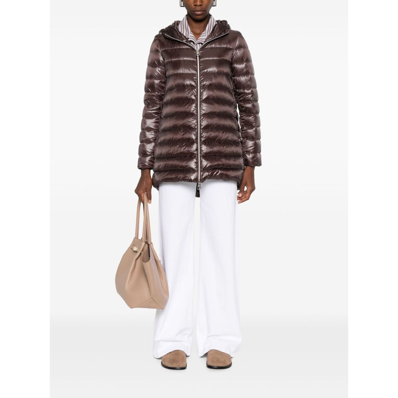 Model wearing chocolate brown Herno Coats Brown down jacket with zip pockets and hood, featuring high-shine finish and A-shape design.