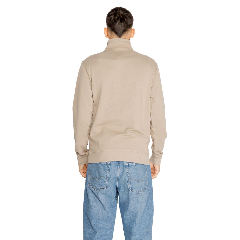 Back view of Hugo Boss Brown Cotton Sweatshirt worn by model with blue jeans, showcasing high collar and relaxed fit.