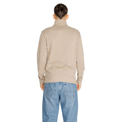 Back view of Hugo Boss Brown Cotton Sweatshirt worn by model with blue jeans, showcasing high collar and relaxed fit.
