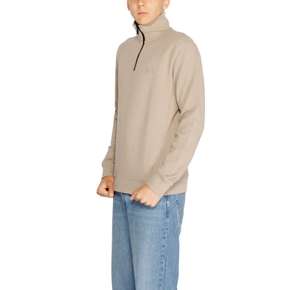 Hugo Boss Brown Cotton Sweatshirt with high collar and half-zip, worn by a model in jeans. Features Boss logo patch for modern style.