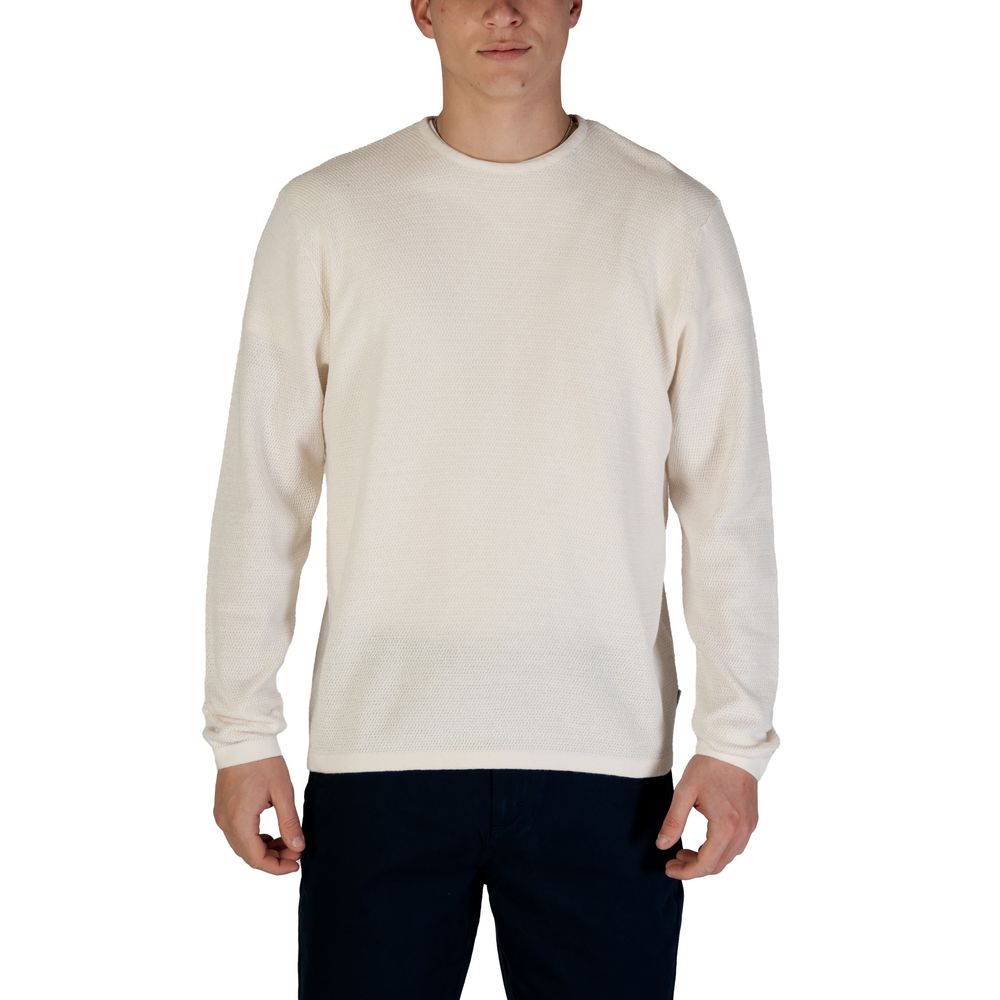 Man wearing Jack Jones White Cotton Sweatshirt with crew neck and long sleeves, showcasing eco-friendly fabric blend with cotton and recycled materials.