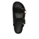 Overhead view of Jimmy Choo Fayence Sandal Low leather sandals with pearls, featuring black rubber sole and faux pearl embellishments.
