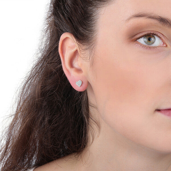 Woman wearing earrings from LA PETITE STORY JEWELRY Mod. LPS02ARQ11 collection, close-up on ear and jewelry.